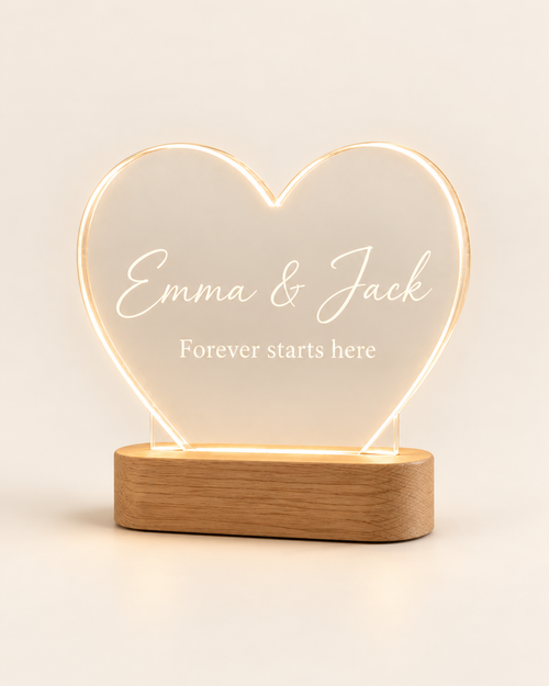 Heart Glow personalized heart acrylic night lamp with oak base on a plain cream background