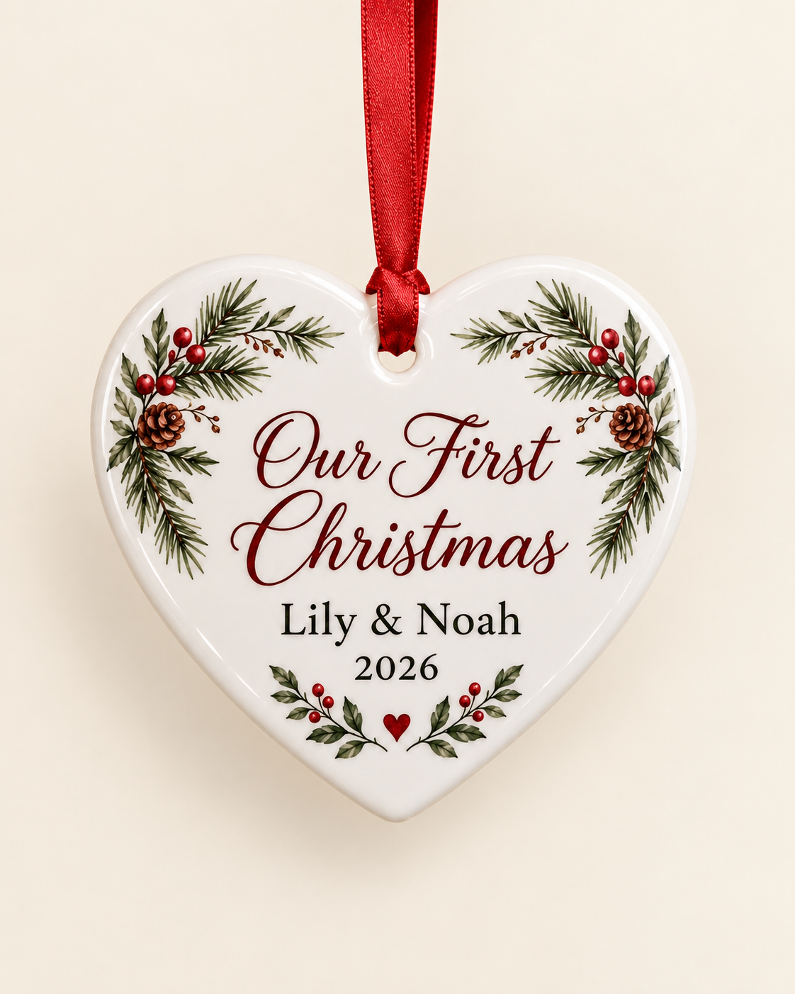 Personalized ceramic heart Christmas ornament on a plain cream background