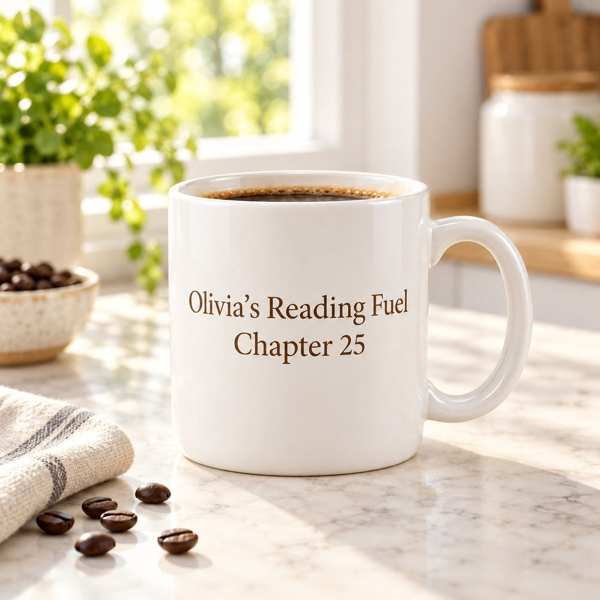Personalized white ceramic mug with custom name and message printed in brown serif text, filled with coffee on a sunlit kitchen counter with coffee beans and a linen napkin