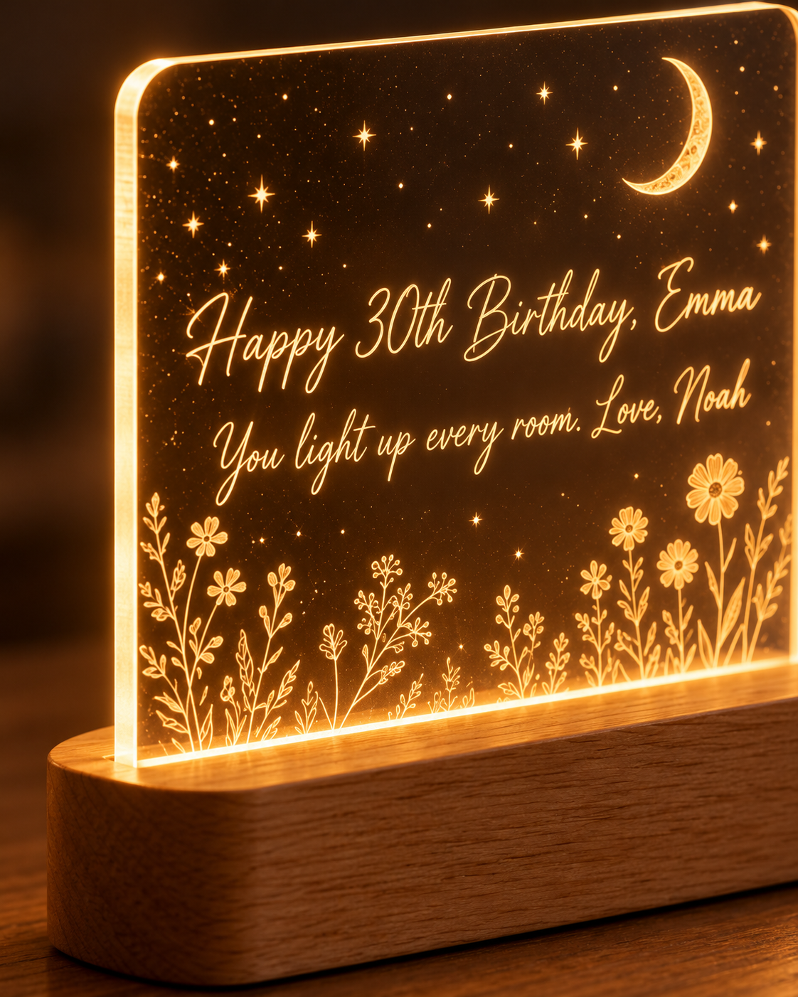 Close-up of engraved acrylic panel and oak base of the Our Glow night light