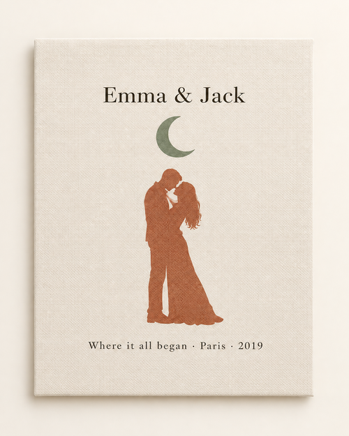 Personalized couple canvas print with names, moon and city date on a plain cream background