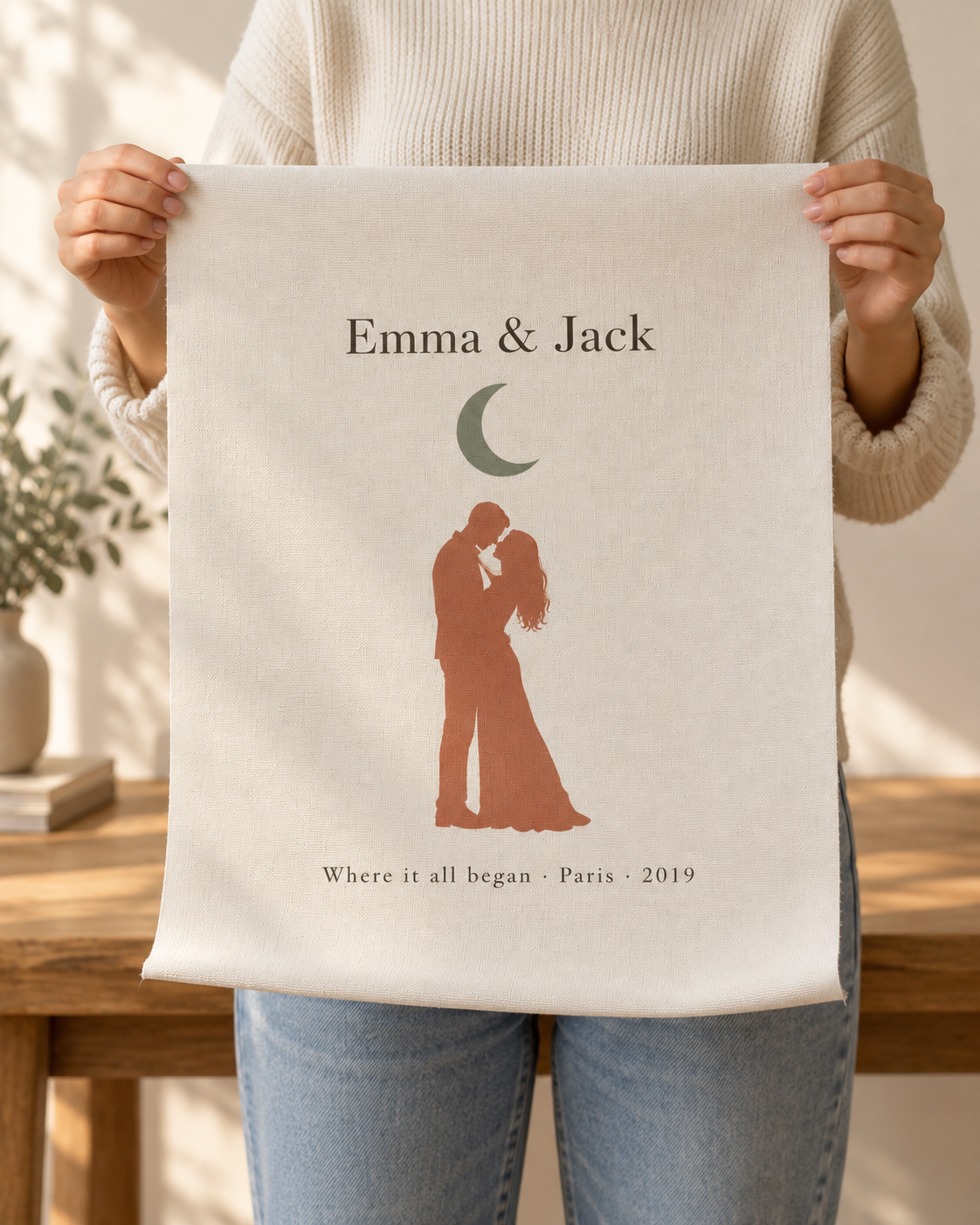 Hands holding the unframed personalized canvas print to show its size